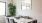a dining table with chairs and a plant on it