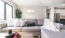 a living room with a couch and a table