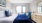 a bedroom with a bed and a chair