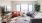 a living room with a tv and couches