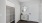 an entrance area with a closet and a mirror