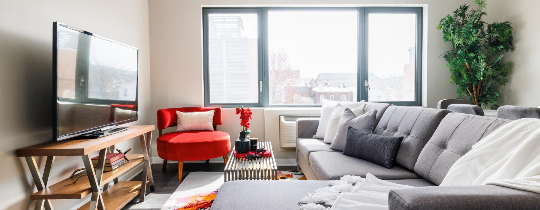 a living room with a tv and couches