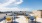 a group of tables and chairs on a rooftop