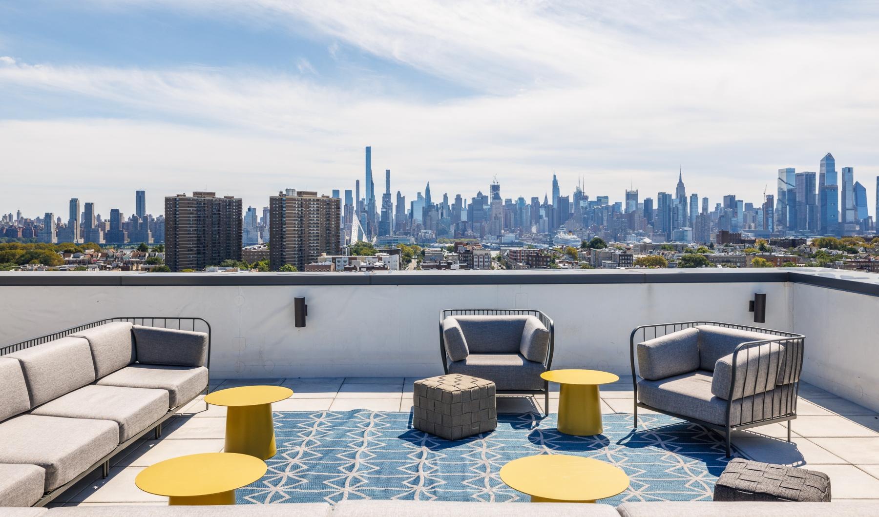 tables with chairs and a view of a city